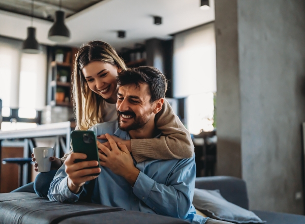 Couple checking the appointment for furnace replacement